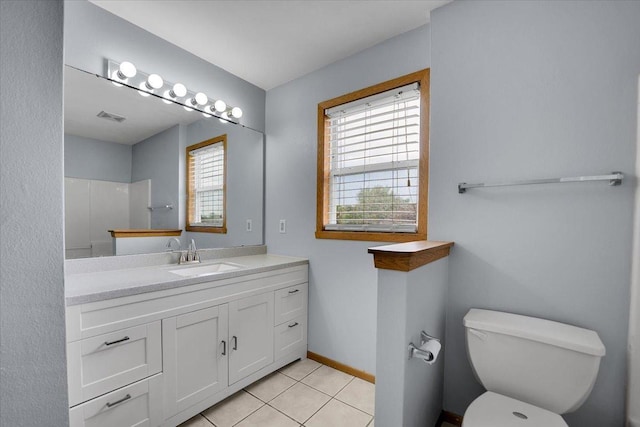 6621 Samantha Ln, Rockford, IL 61107 - bathroom featuring vanity, tile patterned flooring, and a shower