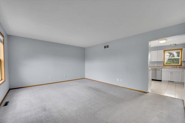 6621 Samantha Ln, Rockford, IL 61107 - spare room with light colored carpet and a sink
