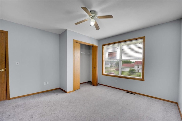 6621 Samantha Ln, Rockford, IL 61107 - unfurnished bedroom with carpet floors, a closet, and a ceiling fan