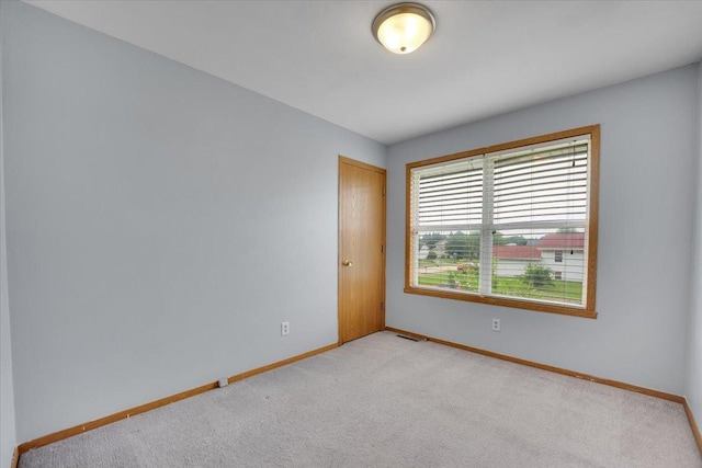 6621 Samantha Ln, Rockford, IL 61107 - spare room with baseboards and light colored carpet