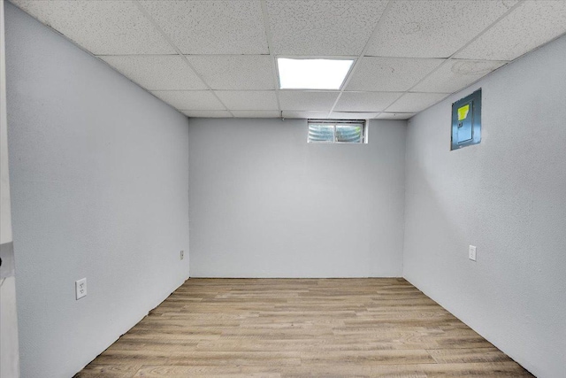 6621 Samantha Ln, Rockford, IL 61107 - basement with a paneled ceiling and light wood-style flooring