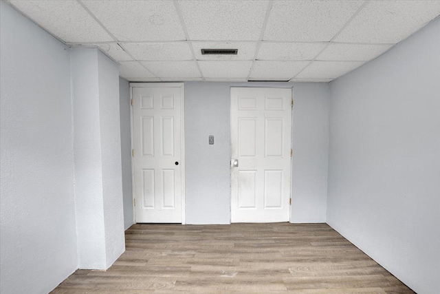 6621 Samantha Ln, Rockford, IL 61107 - spare room featuring a drop ceiling and light wood-type flooring