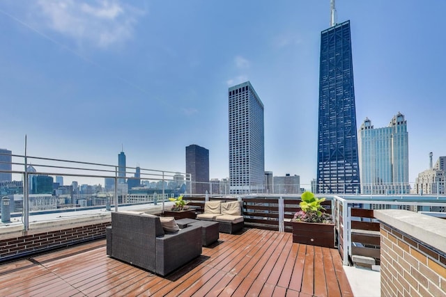 260 E Chestnut St Unit 1904, Chicago, IL 60611 - wooden terrace featuring a skyline view and an outdoor hangout area