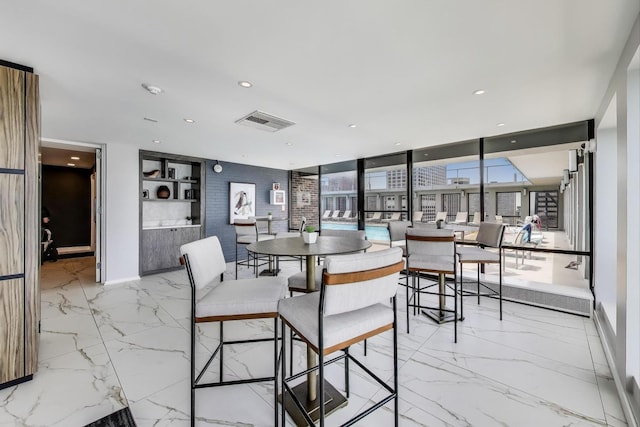 260 E Chestnut St Unit 1904, Chicago, IL 60611 - dining room with light marble finish flooring and recessed lighting