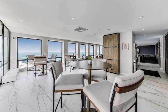 260 E Chestnut St Unit 1904, Chicago, IL 60611 - dining space with light marble finish floors, healthy amount of natural light, and recessed lighting