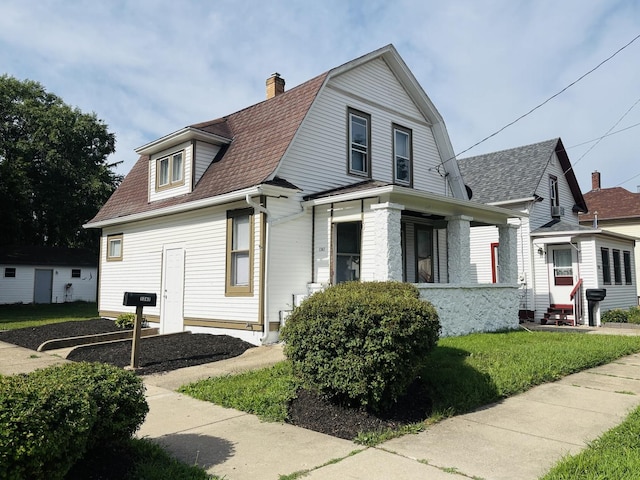 1347 Greenwood Ave, Rockford, IL 61107 - view of property exterior featuring a gambrel roof, a shingled roof, a chimney, and a porch
