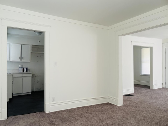 1347 Greenwood Ave, Rockford, IL 61107 - carpeted empty room featuring baseboards