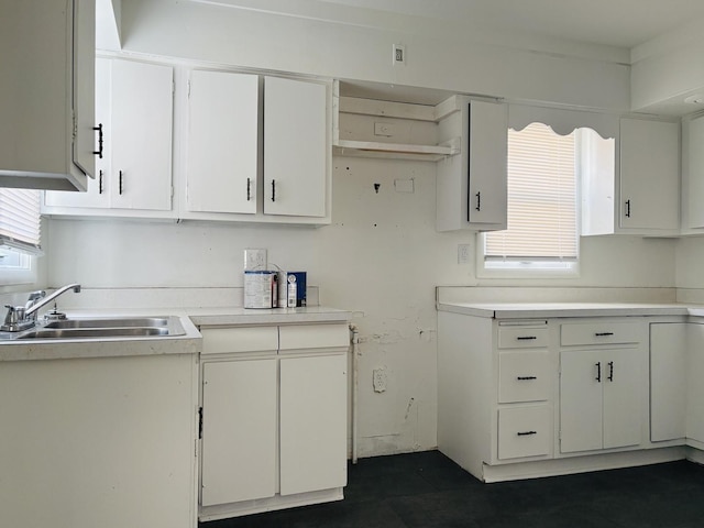1347 Greenwood Ave, Rockford, IL 61107 - kitchen with open shelves, light countertops, and white cabinets