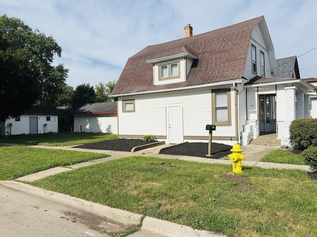 1347 Greenwood Ave, Rockford, IL 61107 - view of front of property featuring a gambrel roof, a front yard, a chimney, and a shingled roof