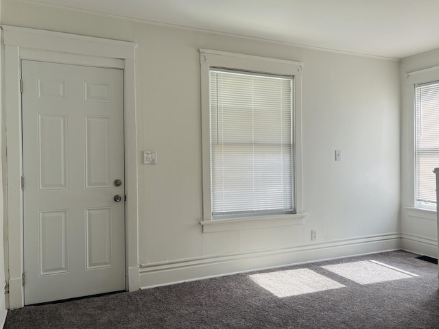 1347 Greenwood Ave, Rockford, IL 61107 - carpeted empty room featuring crown molding