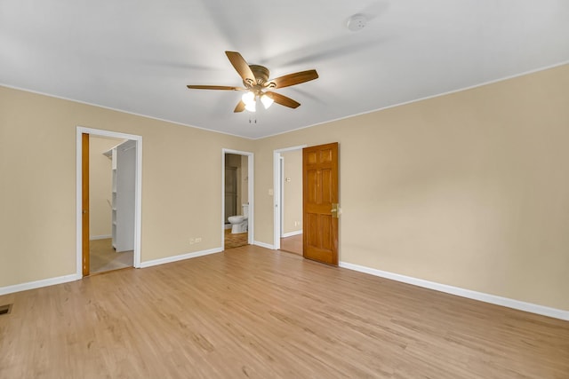 20772 N Elizabeth Ave, Prairie View, IL 60069 - unfurnished bedroom with light wood-style floors, connected bathroom, a walk in closet, and ceiling fan