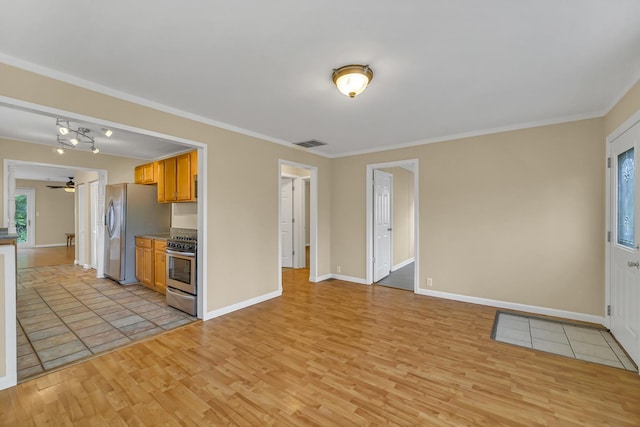 20772 N Elizabeth Ave, Prairie View, IL 60069 - kitchen featuring stainless steel appliances, light wood finished floors, ceiling fan, healthy amount of natural light, and crown molding