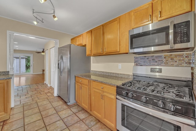 20772 N Elizabeth Ave, Prairie View, IL 60069 - kitchen featuring stainless steel appliances, ceiling fan, tasteful backsplash, light stone counters, and light stone finish flooring