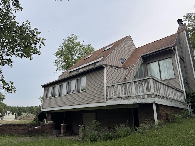 310 Eagle Bluff Dr, Oakwood, IL 61858 - back of property featuring a wooden deck and a chimney