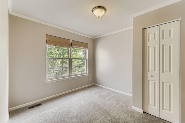 504 Lancaster Dr, Pingree Grove, IL 60140 - unfurnished bedroom with ornamental molding, carpet, and a closet