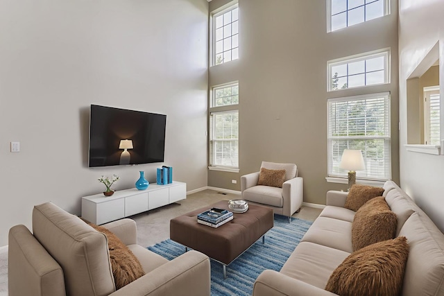 504 Lancaster Dr, Pingree Grove, IL 60140 - living area featuring carpet floors, a high ceiling, and healthy amount of natural light