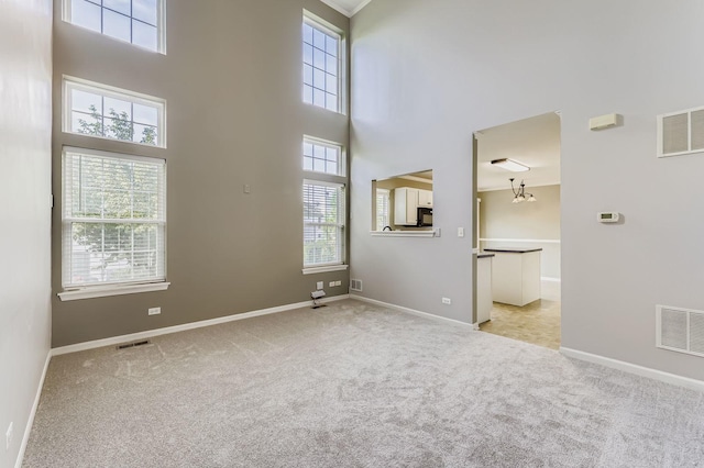 504 Lancaster Dr, Pingree Grove, IL 60140 - empty room featuring light colored carpet and a high ceiling