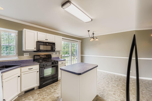 504 Lancaster Dr, Pingree Grove, IL 60140 - kitchen featuring black appliances, dark countertops, crown molding, white cabinets, and a center island