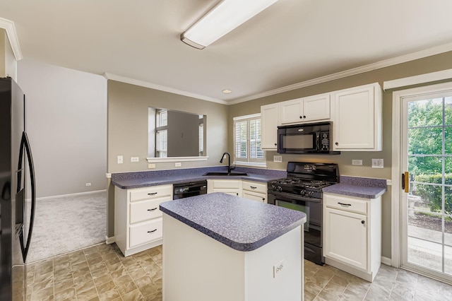 504 Lancaster Dr, Pingree Grove, IL 60140 - kitchen with black appliances, dark countertops, white cabinetry, plenty of natural light, and ornamental molding