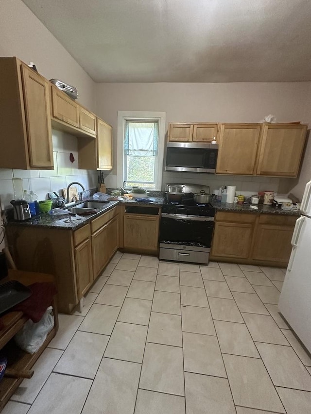 5320 S Carpenter St, Chicago, IL 60609 - kitchen featuring appliances with stainless steel finishes and light tile patterned flooring