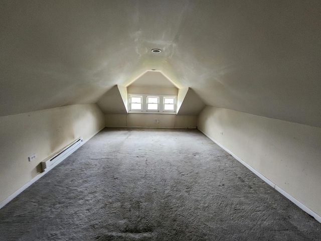 7542 S Prairie Ave, Chicago, IL 60619 - bonus room featuring baseboard heating, lofted ceiling, and carpet floors