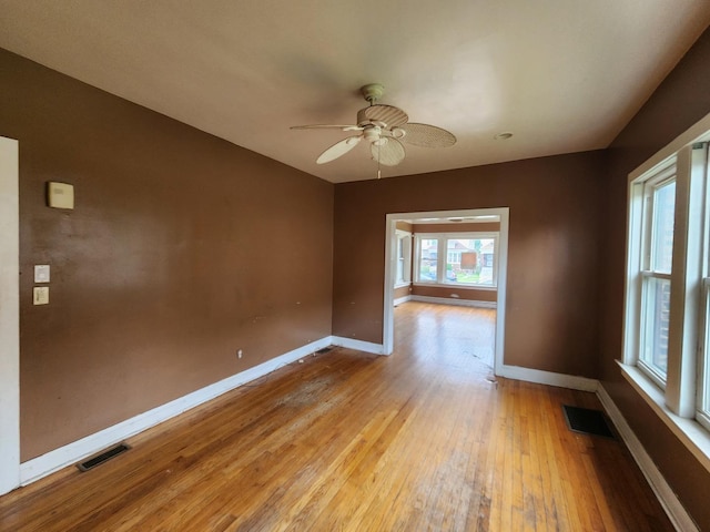 7542 S Prairie Ave, Chicago, IL 60619 - spare room featuring light wood-style flooring and ceiling fan