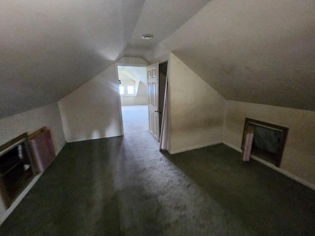 7542 S Prairie Ave, Chicago, IL 60619 - additional living space featuring vaulted ceiling and dark carpet