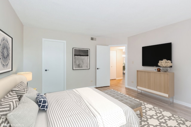 509 Aurora Ave Unit 409, Naperville, IL 60540 - bedroom featuring light wood-style floors and baseboards