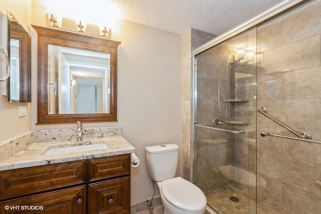 509 Aurora Ave Unit 409, Naperville, IL 60540 - bathroom featuring vanity, a shower stall, and a textured ceiling