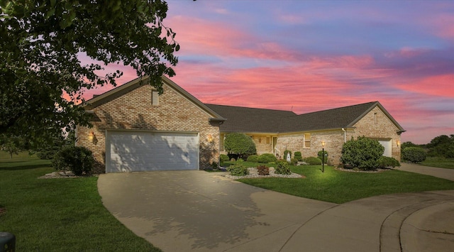1906 Lydia Ct Unit A, Urbana, IL 61802 - traditional-style home featuring driveway, a garage, a front yard, and brick siding