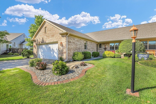 1906 Lydia Ct Unit A, Urbana, IL 61802 - ranch-style home with brick siding, an attached garage, concrete driveway, and a front yard