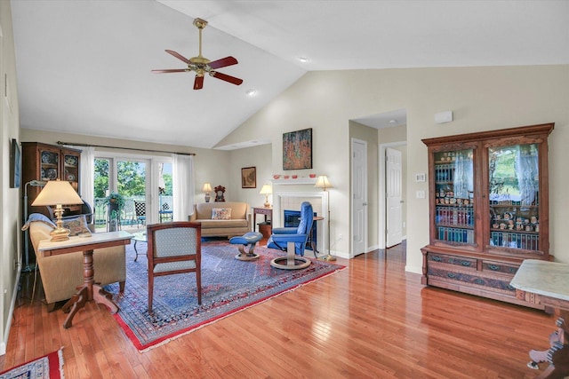 1906 Lydia Ct Unit A, Urbana, IL 61802 - living room with high vaulted ceiling, a ceiling fan, wood finished floors, and a fireplace