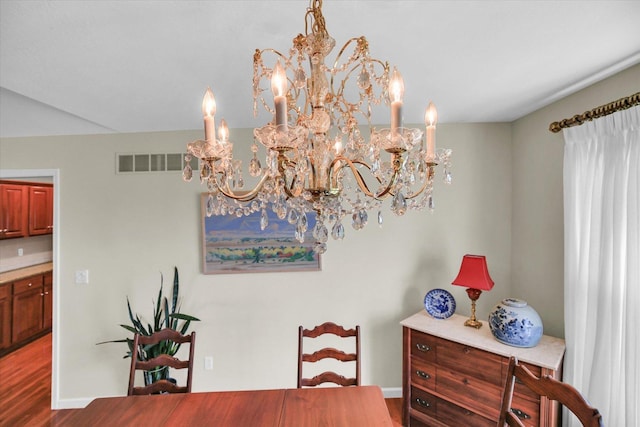 1906 Lydia Ct Unit A, Urbana, IL 61802 - dining space featuring a chandelier and wood finished floors
