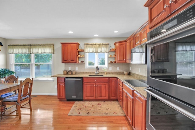 1906 Lydia Ct Unit A, Urbana, IL 61802 - kitchen featuring appliances with stainless steel finishes, open shelves, light wood-style floors, tasteful backsplash, and recessed lighting