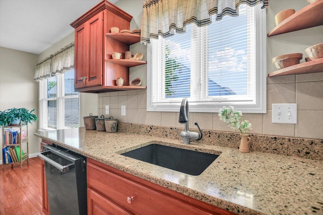1906 Lydia Ct Unit A, Urbana, IL 61802 - kitchen with open shelves, plenty of natural light, wood finished floors, and brown cabinetry