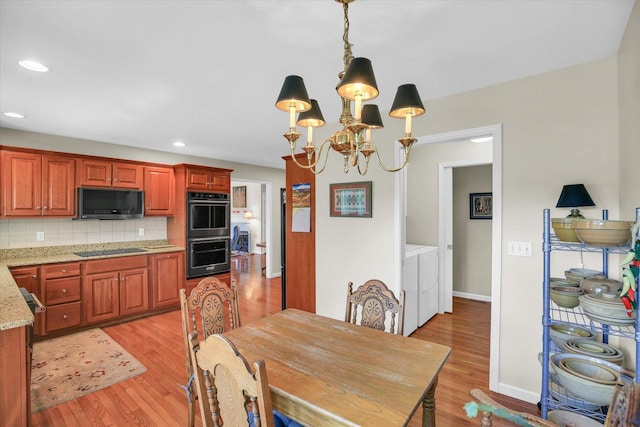 1906 Lydia Ct Unit A, Urbana, IL 61802 - dining space with independent washer and dryer, a chandelier, light wood-style flooring, and recessed lighting