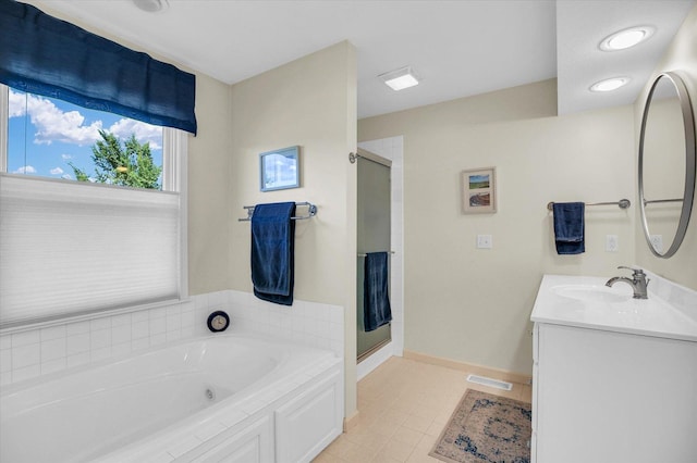 1906 Lydia Ct Unit A, Urbana, IL 61802 - bathroom featuring a shower stall, a jetted tub, vanity, and tile patterned floors
