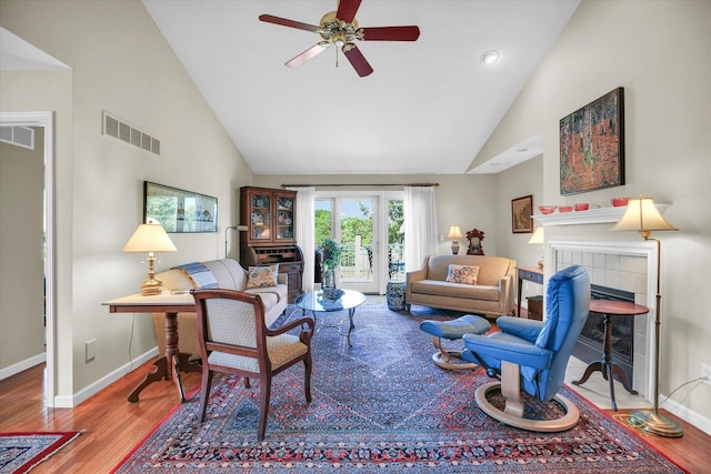 1906 Lydia Ct Unit A, Urbana, IL 61802 - living room featuring high vaulted ceiling, ceiling fan, a tile fireplace, wood finished floors, and recessed lighting