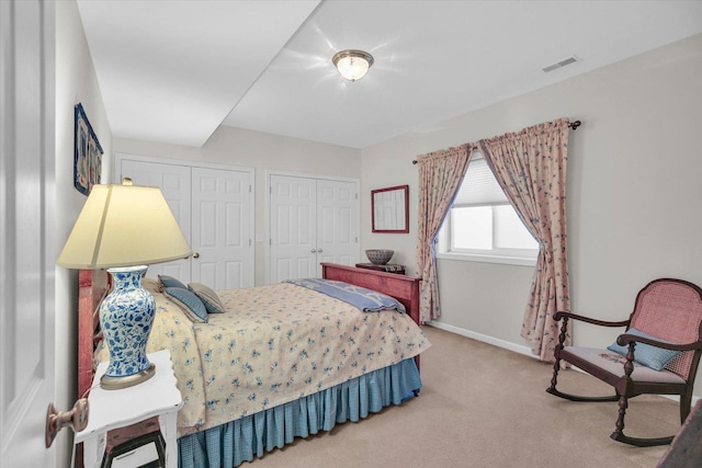 1906 Lydia Ct Unit A, Urbana, IL 61802 - carpeted bedroom with baseboards and two closets