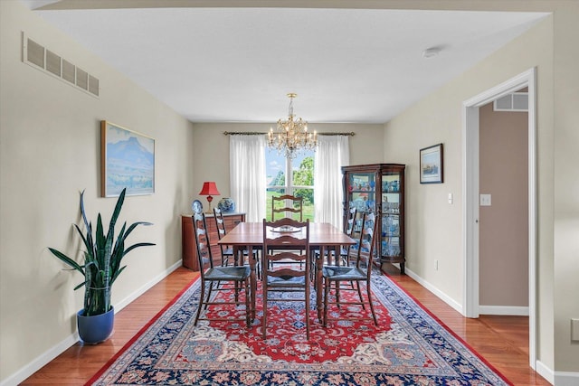 1906 Lydia Ct Unit A, Urbana, IL 61802 - dining space with a chandelier and wood finished floors