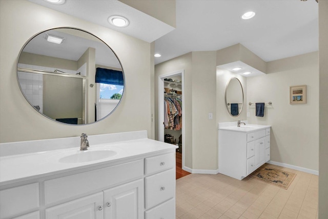 1906 Lydia Ct Unit A, Urbana, IL 61802 - full bath with two vanities, a stall shower, tile patterned floors, recessed lighting, and a spacious closet