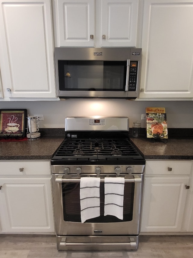 2949 Brossman St, Naperville, IL 60564 - kitchen featuring appliances with stainless steel finishes, white cabinetry, and dark countertops
