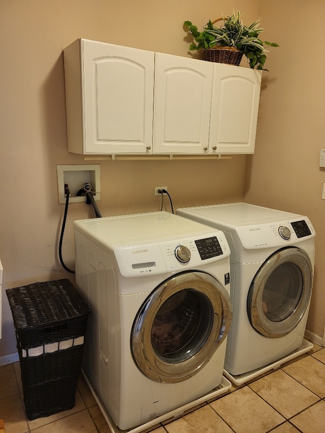 2949 Brossman St, Naperville, IL 60564 - laundry room featuring cabinet space, separate washer and dryer, and light tile patterned floors