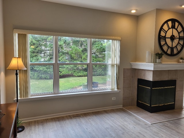 2949 Brossman St, Naperville, IL 60564 - living room with wood finished floors and a tiled fireplace