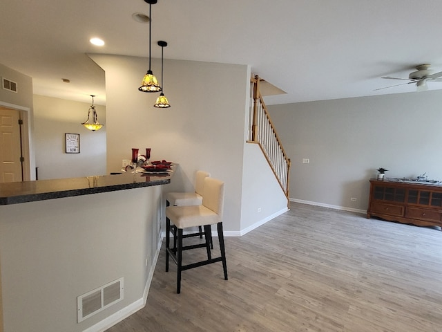 2949 Brossman St, Naperville, IL 60564 - kitchen featuring wood finished floors, a ceiling fan, dark countertops, pendant lighting, and recessed lighting