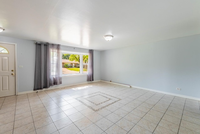 100 Patricia Dr, Schaumburg, IL 60193 - unfurnished room with healthy amount of natural light and light tile patterned flooring