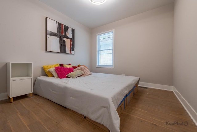 11956 S Harvard Ave, Chicago, IL 60628 - bedroom featuring hardwood / wood-style floors and baseboards