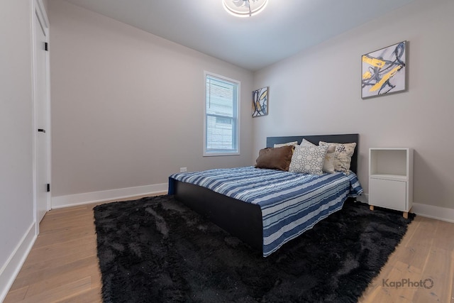 11956 S Harvard Ave, Chicago, IL 60628 - bedroom with light wood-type flooring and baseboards