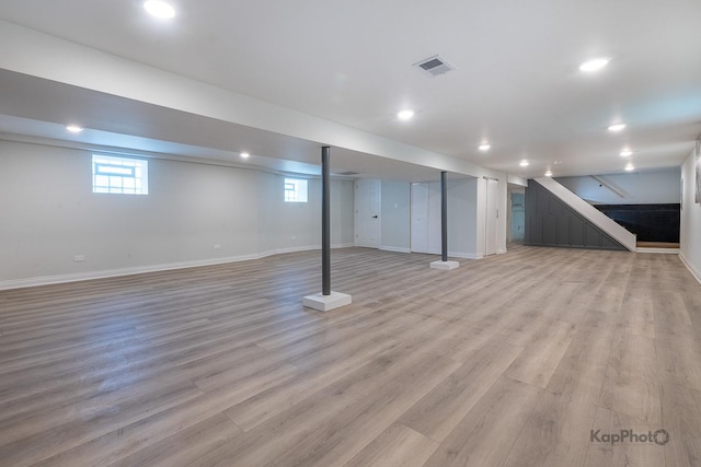 11956 S Harvard Ave, Chicago, IL 60628 - below grade area with light wood-style floors, recessed lighting, and stairs