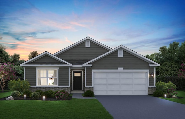 2275 Redwood Trl, Wonder Lake, IL 60097 - view of front of home featuring concrete driveway, a front yard, an attached garage, and stone siding